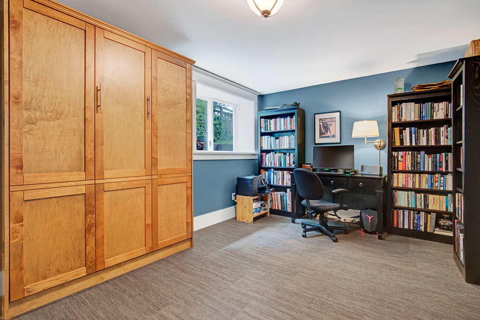 Photo of a mid-sized arts and crafts walk-out basement in Seattle with blue walls, brown floor and bamboo floors.