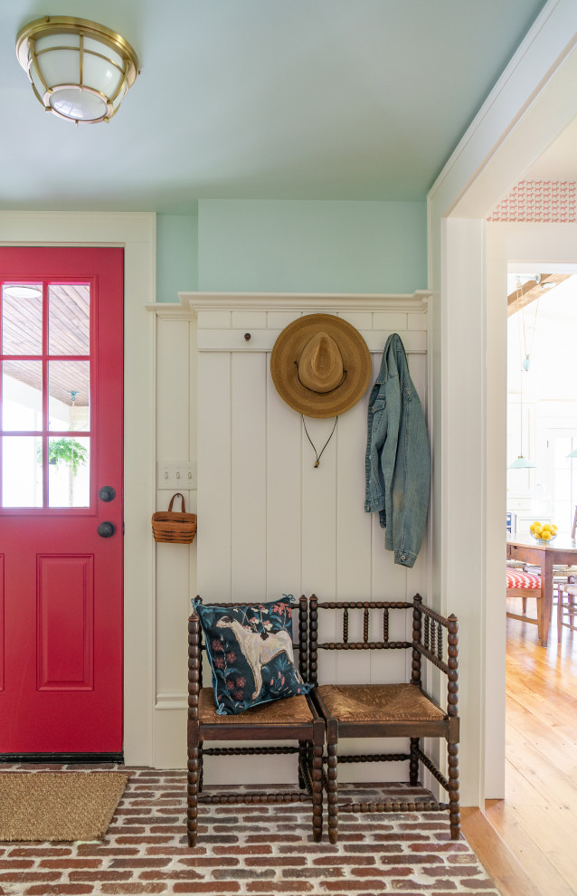 Small transitional mudroom in Boston with brick floors, a red front door and panelled walls.