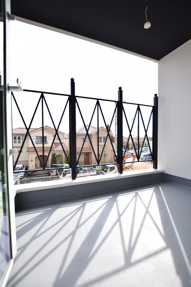 Photo of a mid-sized scandinavian balcony in Other with metal railing.