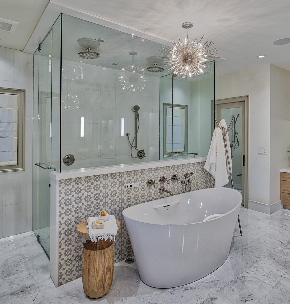 Photo of a mid-sized eclectic master bathroom in Las Vegas with flat-panel cabinets, white cabinets, a freestanding tub, a double shower, a bidet, white tile, marble, white walls, marble floors, an undermount sink, engineered quartz benchtops, white floor, a hinged shower door and white benchtops.