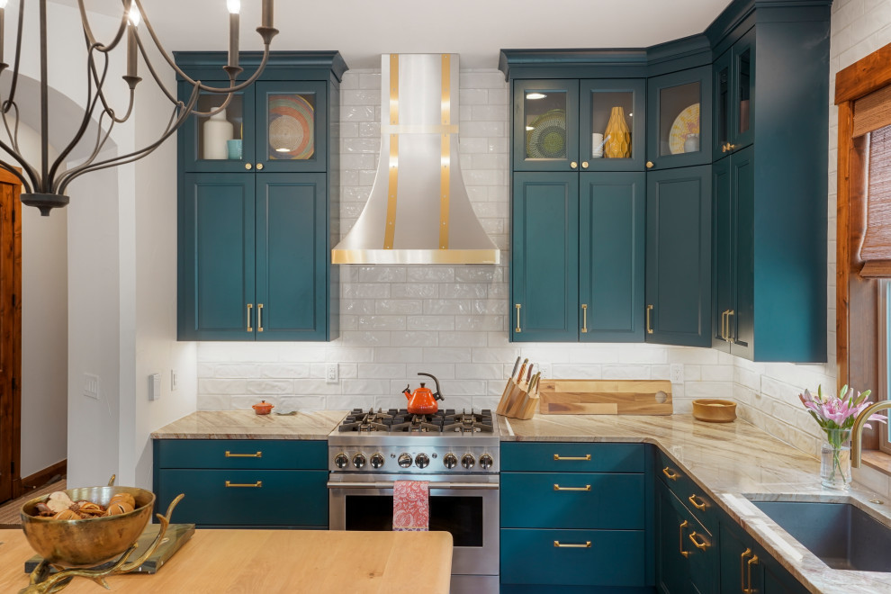 Inspiration for a large transitional u-shaped exposed beam open concept kitchen remodel in Denver with an undermount sink, recessed-panel cabinets, blue cabinets, wood countertops, white backsplash, stainless steel appliances and an island