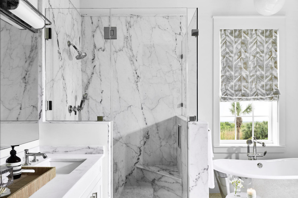Beach Bungalow - Freestanding bathtub - large coastal master white tile light wood floor, beige floor and double-sink freestanding bathtub idea in Houston with recessed-panel cabinets, white cabinets, white walls, a drop-in sink, a hinged shower door, white countertops and a built-in vanity