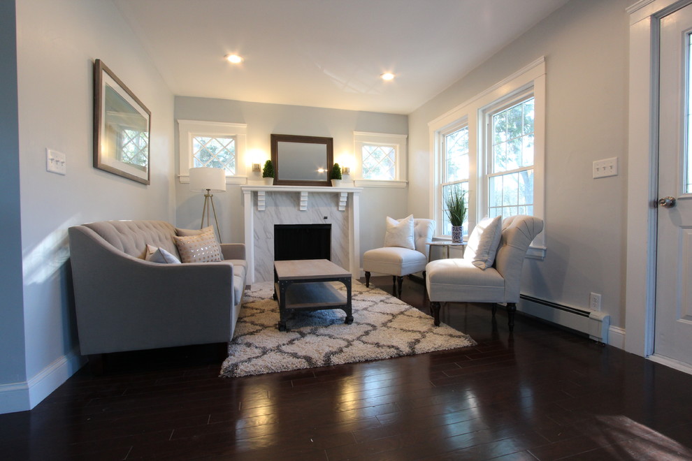 Design ideas for a small transitional formal open concept living room in Boston with grey walls, dark hardwood floors, a standard fireplace, a tile fireplace surround, no tv and brown floor.