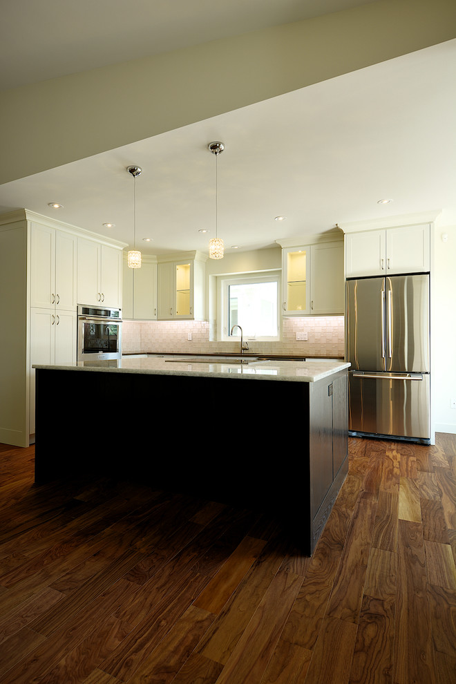 Example of a transitional kitchen design in Calgary