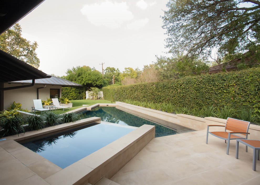 Inspiration for a transitional backyard stone and custom-shaped hot tub remodel in Austin