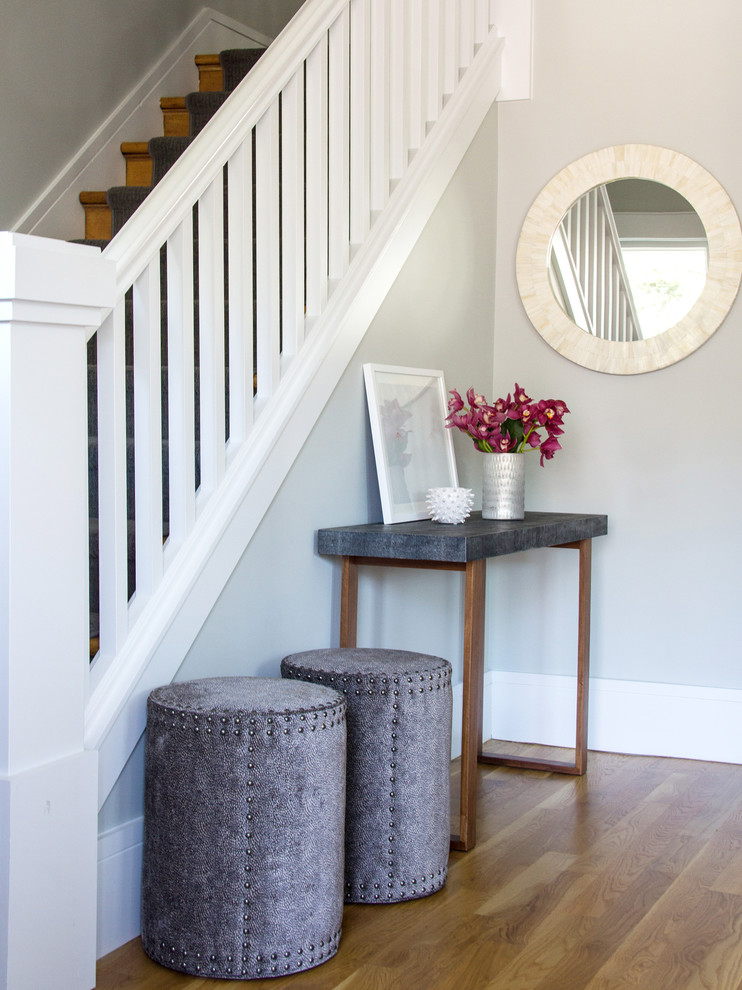 Example of a mid-sized transitional light wood floor foyer design in San Francisco with gray walls and a blue front door