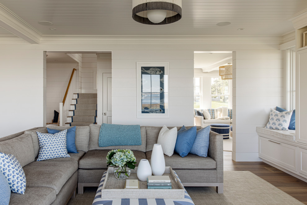 Design ideas for a large beach style open concept family room in Boston with white walls, medium hardwood floors, a wall-mounted tv, timber and planked wall panelling.