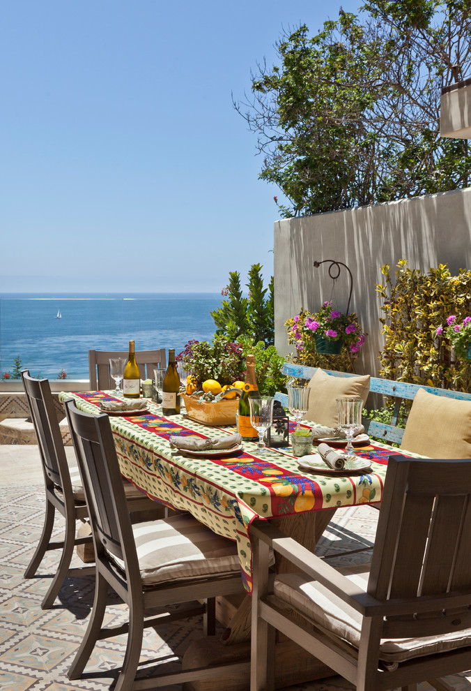 Inspiration for a mediterranean patio in Los Angeles with tile and no cover.