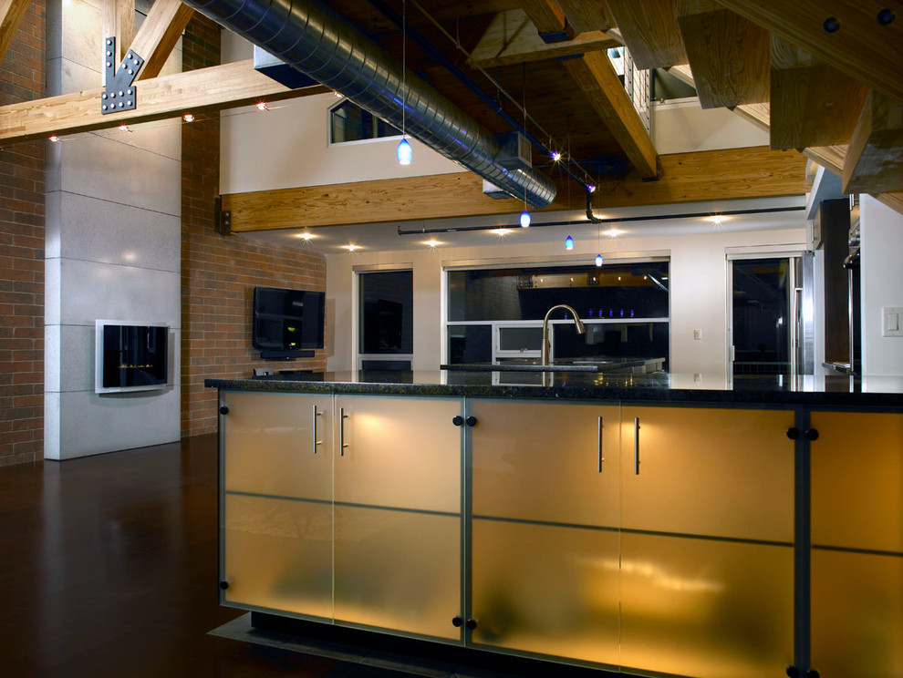 This is an example of a mid-sized industrial l-shaped open plan kitchen in Detroit with an undermount sink, flat-panel cabinets, dark wood cabinets, stainless steel appliances and with island.