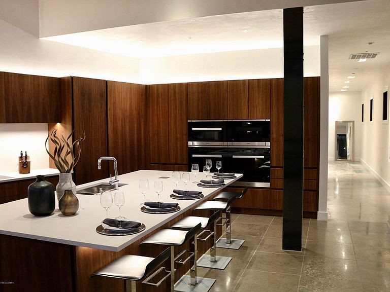 Design ideas for a large modern u-shaped open plan kitchen in Denver with flat-panel cabinets, medium wood cabinets and with island.