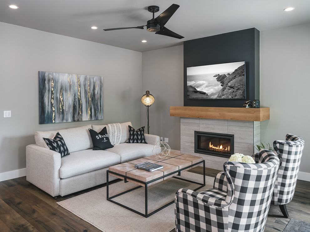 Inspiration for a transitional family room in Other with grey walls, dark hardwood floors, a ribbon fireplace, a tile fireplace surround, a wall-mounted tv and brown floor.
