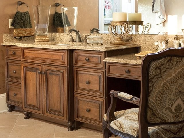 Design ideas for a mid-sized traditional master bathroom in Orlando with raised-panel cabinets, dark wood cabinets, beige walls, ceramic floors, an undermount sink, granite benchtops and beige floor.