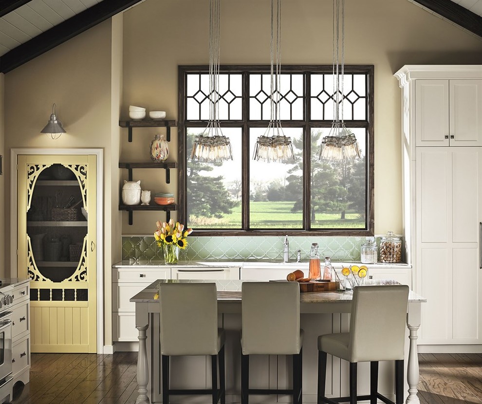 Kitchen - mid-sized transitional l-shaped dark wood floor kitchen idea with an undermount sink, recessed-panel cabinets, white cabinets, green backsplash, glass tile backsplash and an island