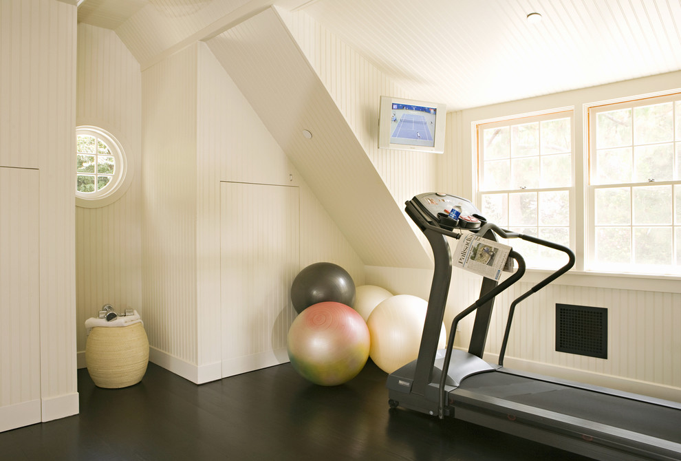 Design ideas for a traditional home gym in Los Angeles with white walls and black floors.