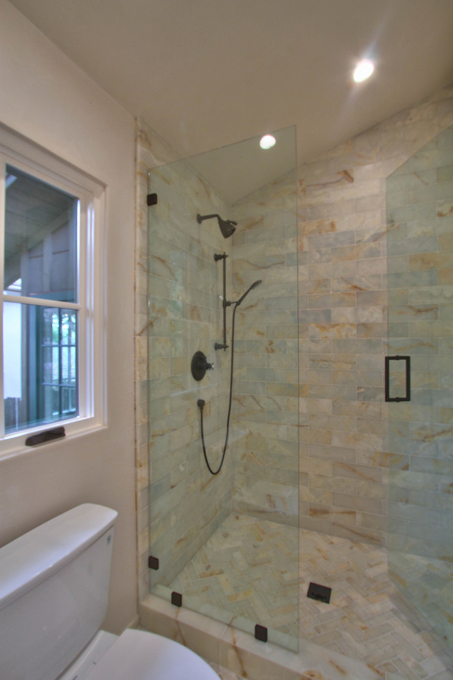 Mid-sized transitional master bathroom in Other with shaker cabinets, white cabinets, a drop-in tub, a corner shower, beige tile, marble, beige walls, porcelain floors, an undermount sink, solid surface benchtops, beige floor and a hinged shower door.