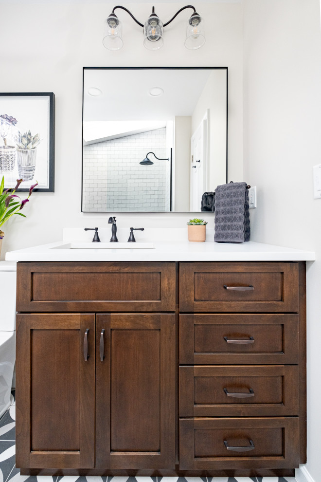 Mid-sized country bathroom in New York with shaker cabinets, medium wood cabinets, an open shower, a two-piece toilet, white tile, subway tile, cement tiles, an undermount sink, quartzite benchtops, an open shower and white benchtops.
