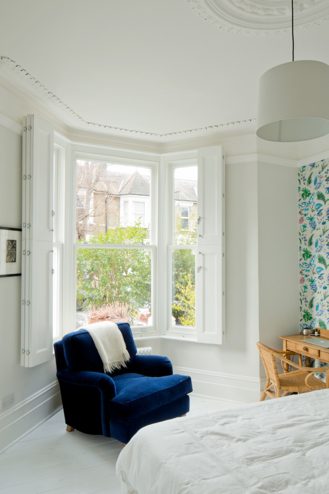Design ideas for a medium sized classic master bedroom in London with white walls.