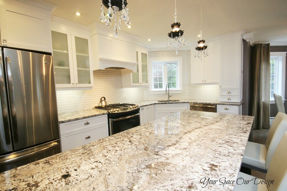 Example of a mid-sized transitional l-shaped medium tone wood floor eat-in kitchen design with an undermount sink, raised-panel cabinets, white cabinets, granite countertops, white backsplash, porcelain backsplash, stainless steel appliances and a peninsula