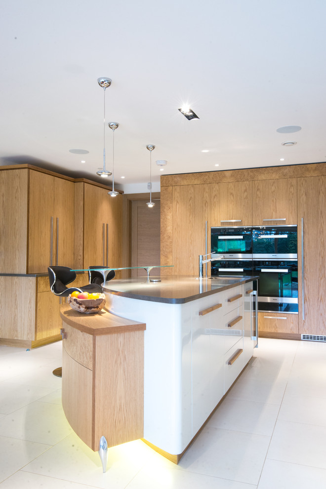 Design ideas for a large contemporary eat-in kitchen in London with an undermount sink, flat-panel cabinets, white cabinets, quartzite benchtops, grey splashback, stone slab splashback, ceramic floors and with island.