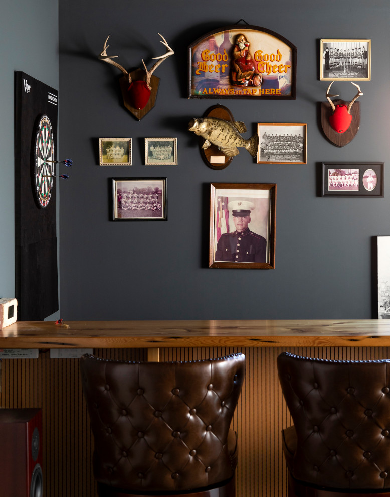Example of an eclectic home bar design in Other with wood countertops