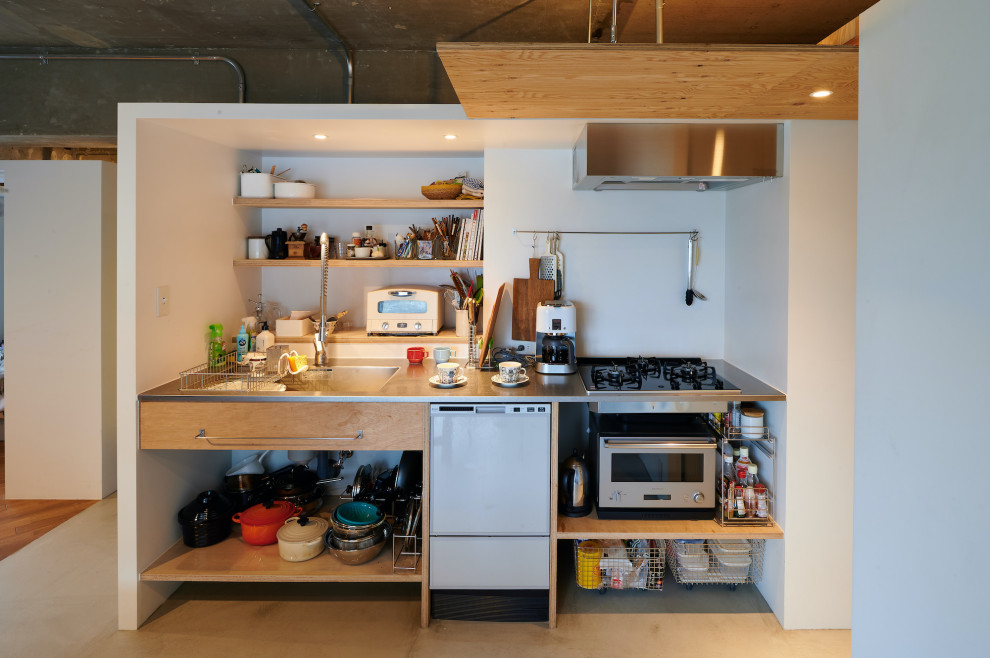 Photo of a medium sized urban single-wall open plan kitchen in Tokyo with an integrated sink, open cabinets, beige cabinets, stainless steel worktops, white splashback, tonge and groove splashback, white appliances, concrete flooring, no island, grey floors, grey worktops and a timber clad ceiling.