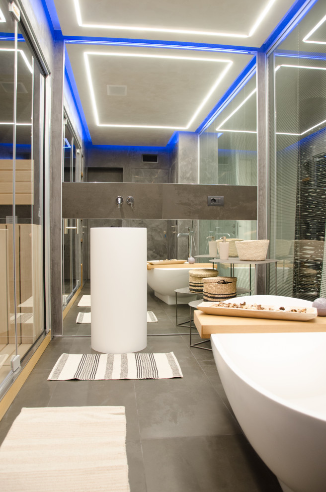 This is an example of a large modern bathroom in Other with a freestanding tub, black tile, porcelain tile, a hinged shower door, a freestanding vanity and recessed.