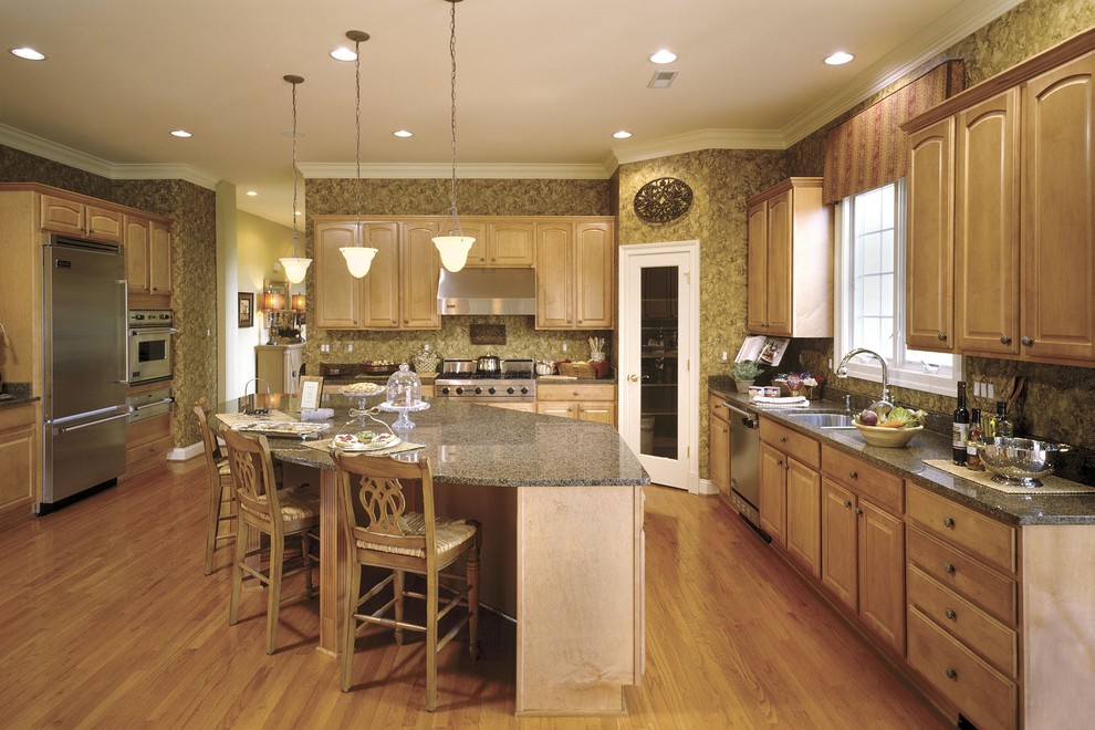 Eat-in kitchen - huge transitional l-shaped light wood floor eat-in kitchen idea in DC Metro with an undermount sink, raised-panel cabinets, light wood cabinets, granite countertops, beige backsplash, stainless steel appliances and green walls