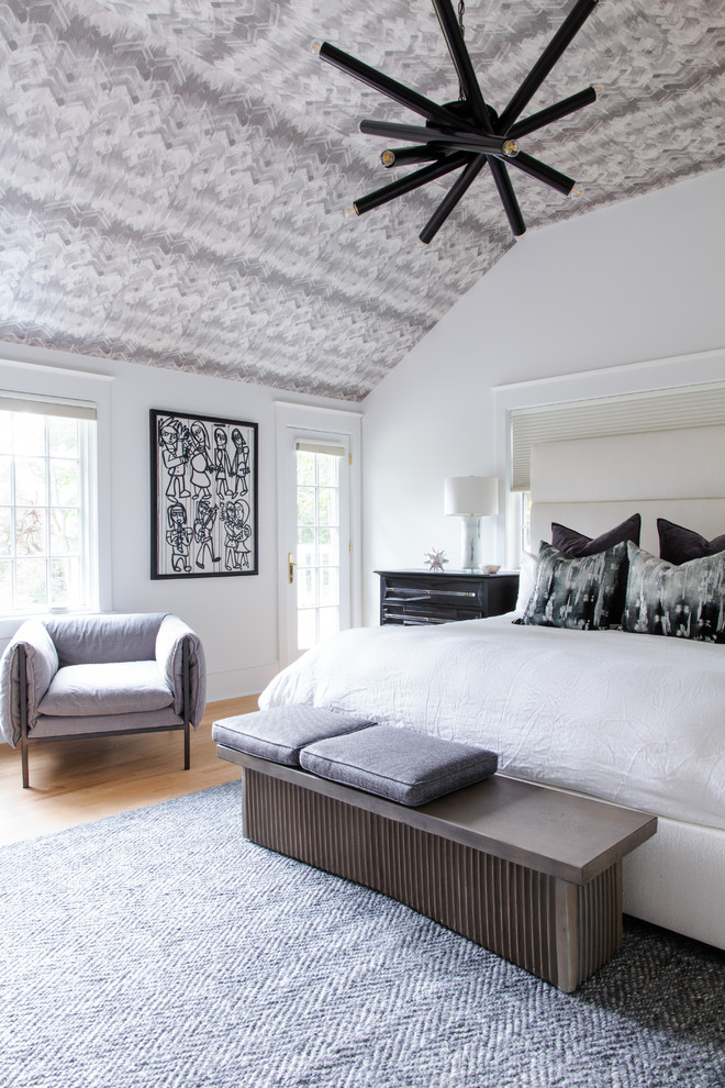 Inspiration for a transitional bedroom in Philadelphia with white walls, medium hardwood floors and brown floor.