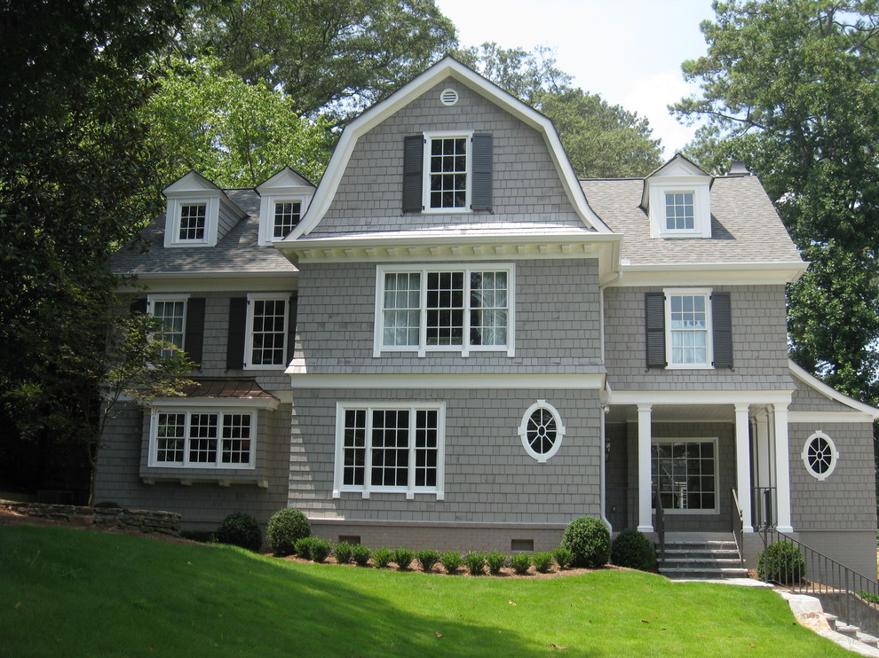 Inspiration for a large timeless gray three-story wood exterior home remodel in Atlanta with a gambrel roof