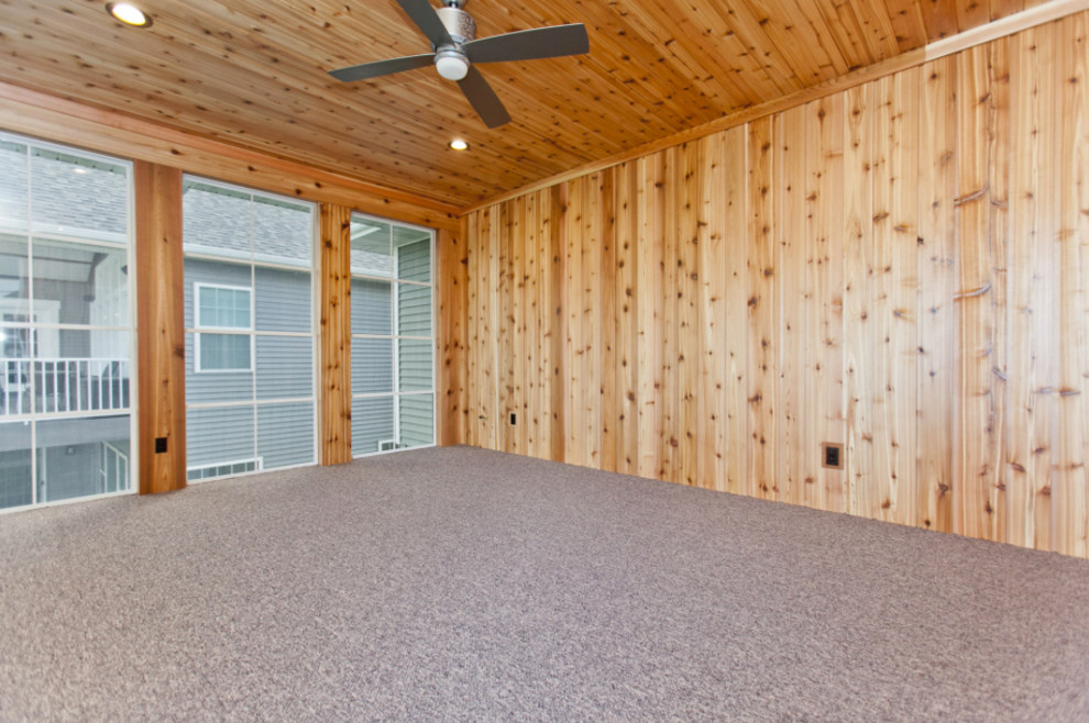 Mid-sized mountain style guest home design photo in Cedar Rapids with brown walls