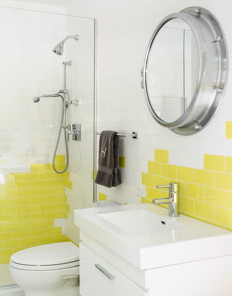 Design ideas for a contemporary kids bathroom in New York with flat-panel cabinets, white cabinets, white tile, yellow tile, subway tile and an integrated sink.