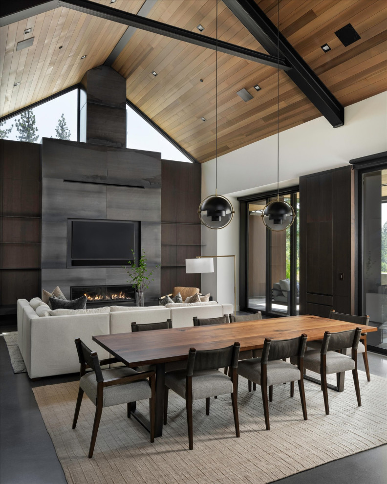 Great room - contemporary concrete floor, black floor, exposed beam, vaulted ceiling and wood ceiling great room idea in Sacramento with white walls