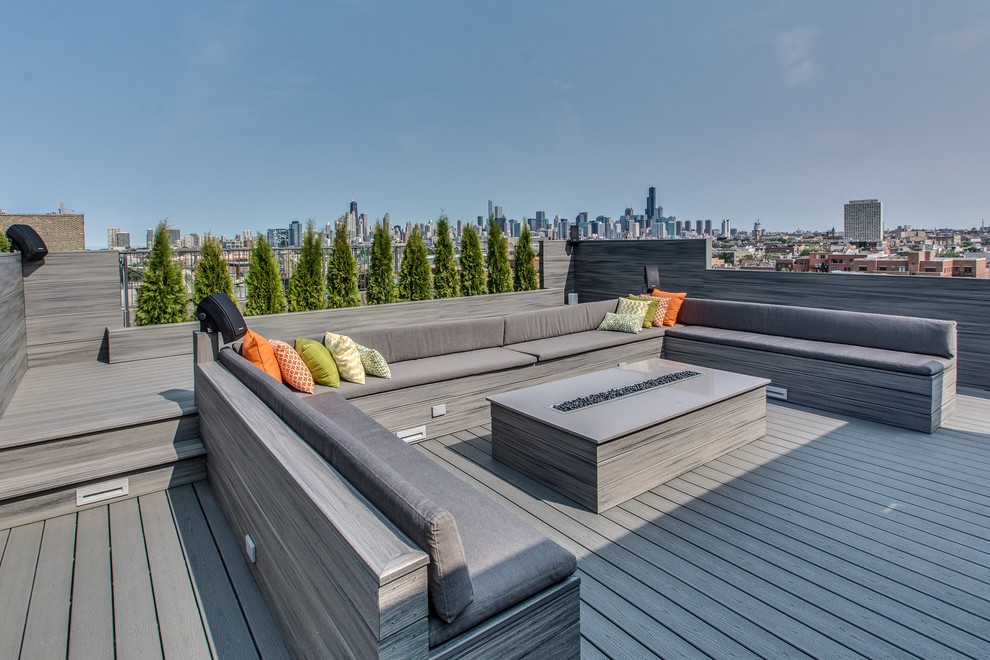 Inspiration for an expansive modern rooftop deck in Chicago with no cover and a fire feature.