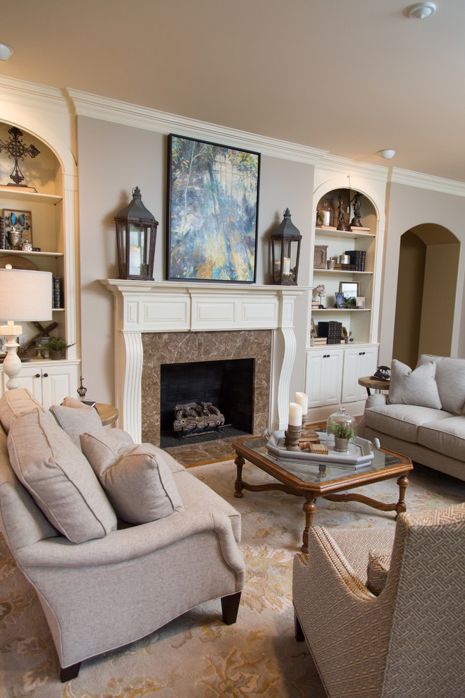 Mid-sized transitional formal and enclosed light wood floor living room photo with gray walls, a standard fireplace, a stone fireplace and no tv