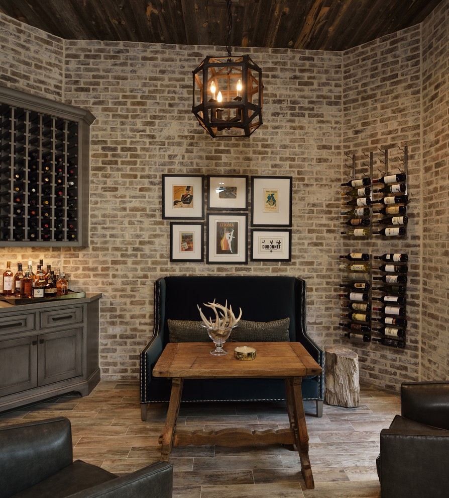 Design ideas for a large traditional wine cellar in Houston with light hardwood floors and storage racks.