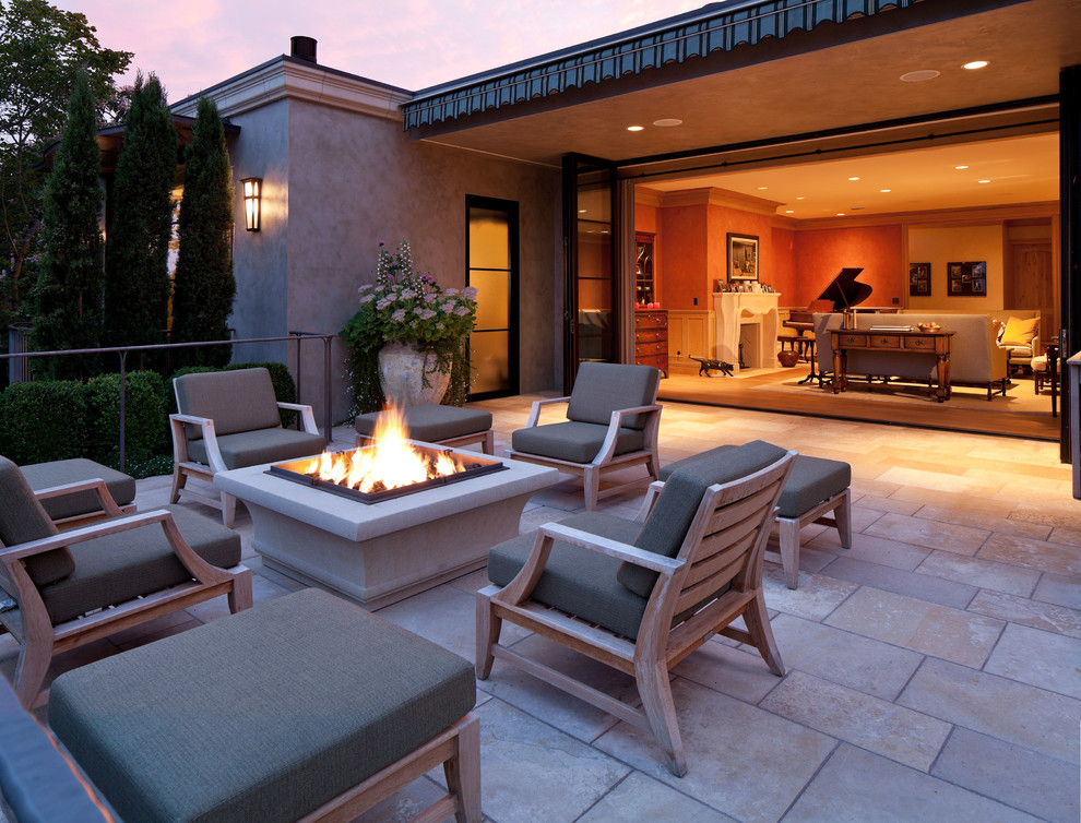 Inspiration for a traditional patio in Seattle with a fire feature, tile and no cover.