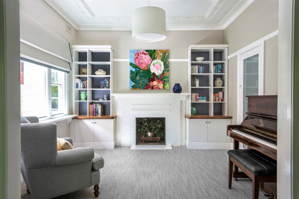 Inspiration for a mid-sized contemporary enclosed carpeted living room remodel in Melbourne with white walls, a standard fireplace and a brick fireplace