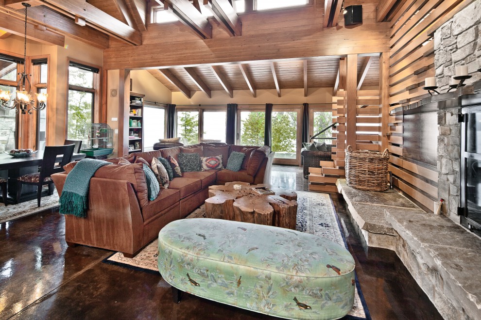 Photo of a country living room in Seattle with concrete floors.