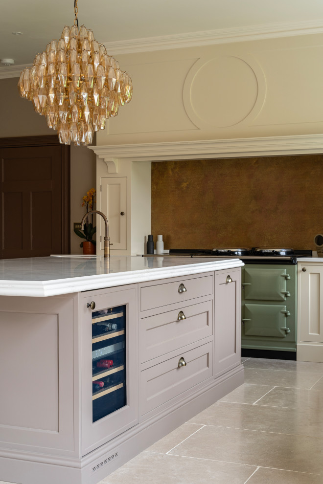Inspiration for a large traditional l-shaped eat-in kitchen in Oxfordshire with an undermount sink, shaker cabinets, beige cabinets, quartzite benchtops, brown splashback, ceramic floors, with island, beige floor and white benchtop.