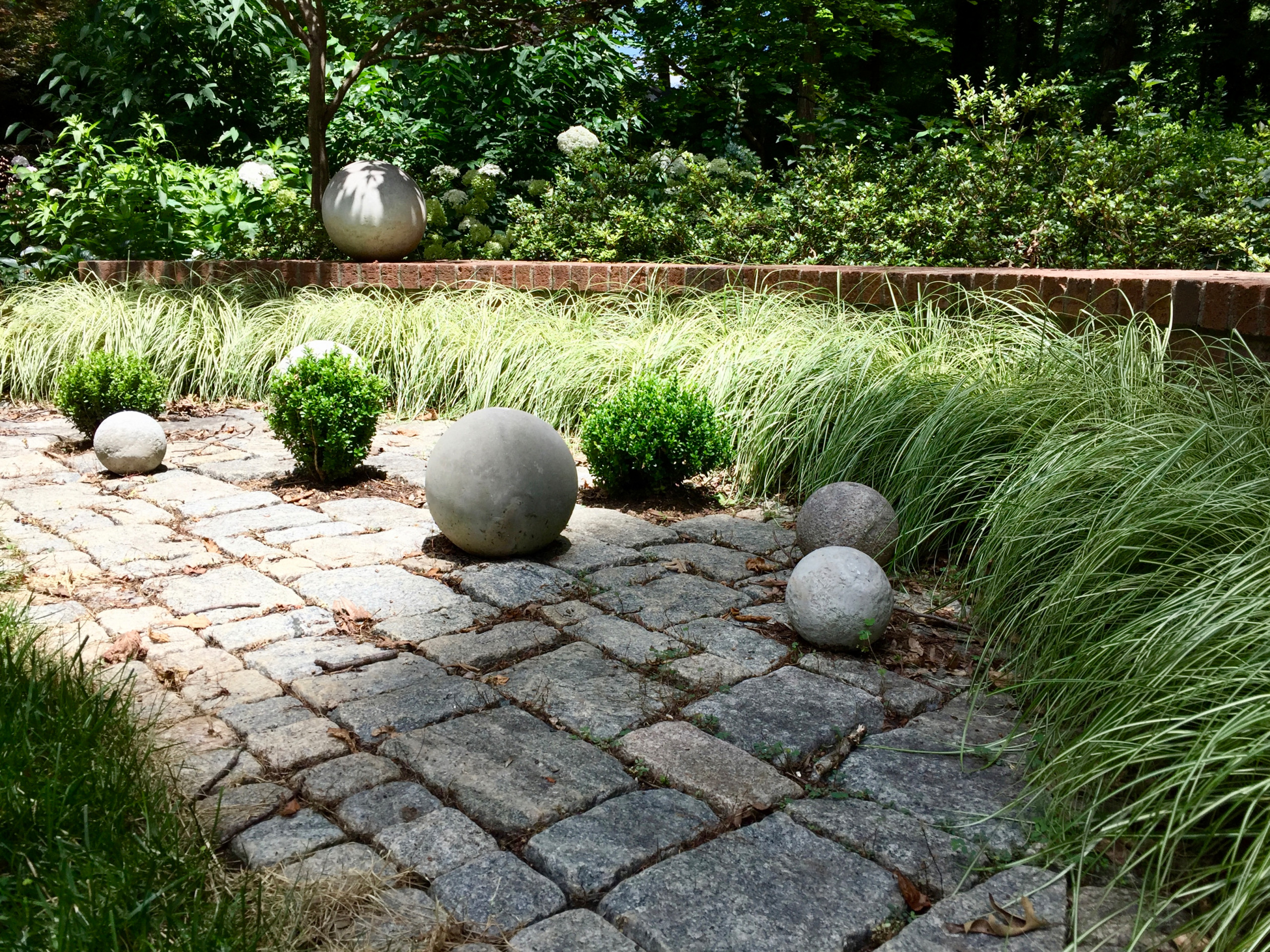 Contemporary Accents Elevate a Traditional Garden.