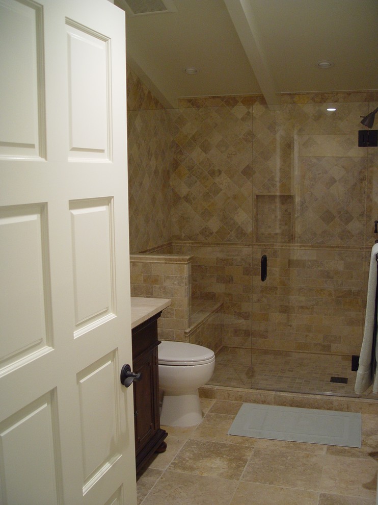 Design ideas for a mid-sized traditional bathroom in Santa Barbara with an undermount sink, distressed cabinets, an open shower, a one-piece toilet, beige walls and limestone floors.