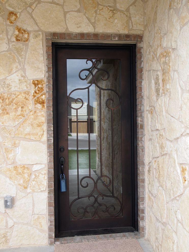 Front door - small traditional concrete floor front door idea in Austin with a metal front door and beige walls