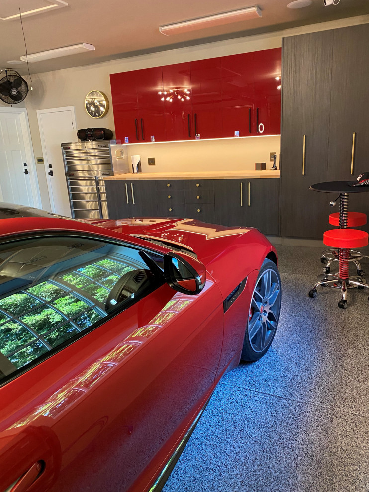 Large contemporary attached garage workshop in San Francisco with three or more cars.