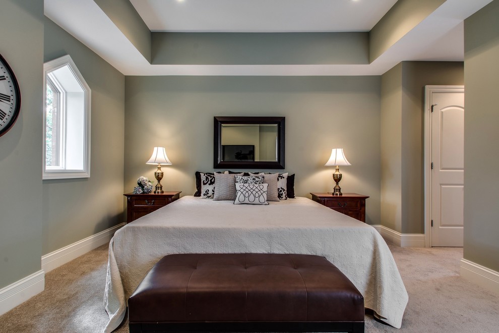 Photo of a transitional bedroom in Chicago with grey walls, carpet and no fireplace.