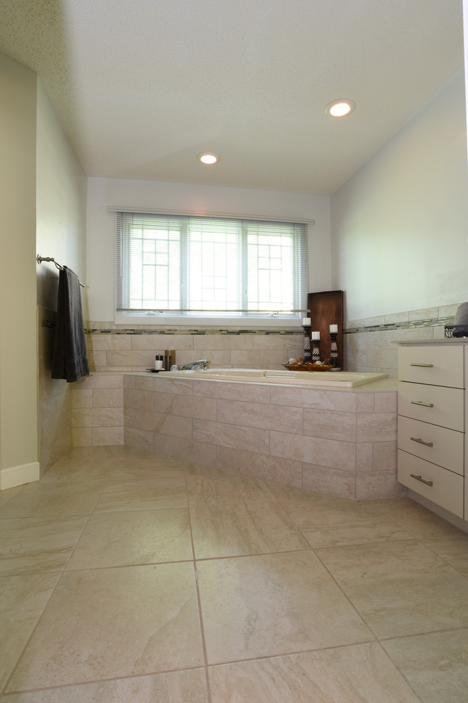 Design ideas for a traditional master bathroom in Other with flat-panel cabinets, white cabinets, a hot tub, beige tile, porcelain tile, white walls, porcelain floors, an undermount sink and beige floor.