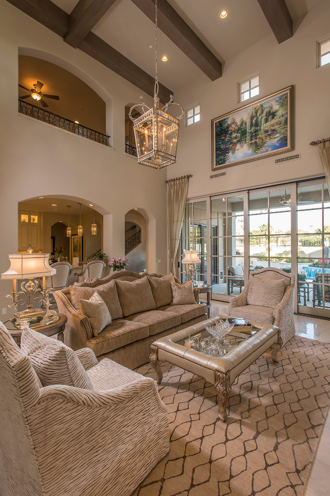 This is an example of a mid-sized mediterranean formal open concept living room in Phoenix with beige walls, marble floors, no fireplace and no tv.