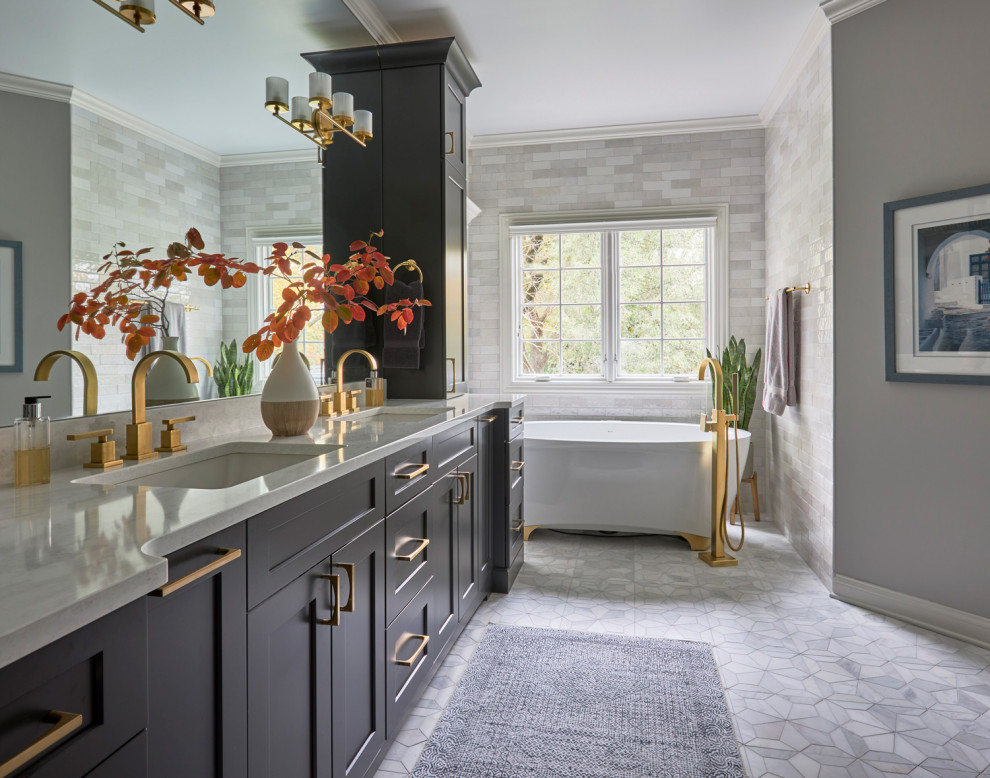 Inspiration for a large traditional ensuite bathroom in Chicago with shaker cabinets, brown cabinets, a freestanding bath, an alcove shower, a submerged sink, a sliding door and double sinks.