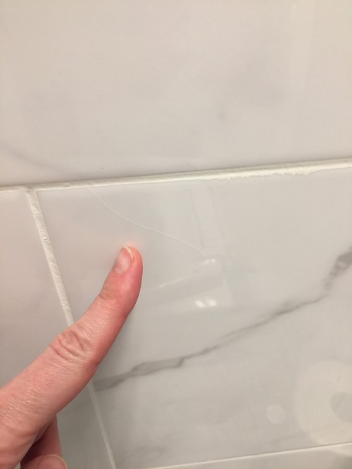 Hairline cracks in brand new shower tile