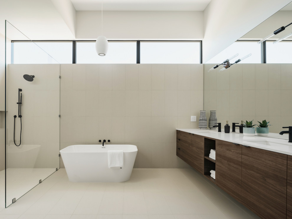 Large minimalist master beige tile and porcelain tile porcelain tile, beige floor and double-sink bathroom photo in Phoenix with flat-panel cabinets, dark wood cabinets, a two-piece toilet, white walls, an undermount sink, quartz countertops, white countertops and a floating vanity