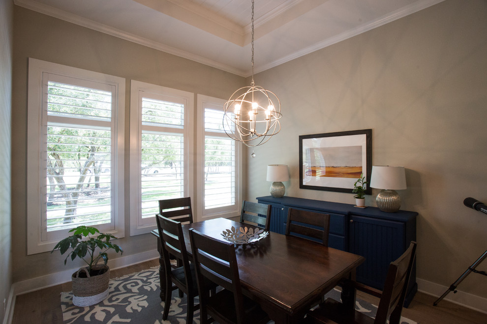 Inspiration for a mid-sized transitional light wood floor and beige floor kitchen/dining room combo remodel in Austin with beige walls and no fireplace
